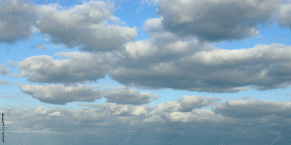 The sky and clouds, dark thick autumn clouds with the evening blue sky in the backgroun The sky and clouds, dark thick autumn clouds with the evening blue sky in the backgroun