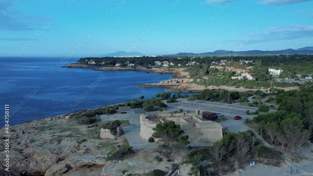 Playa y Castillo de Sant Jordi d'Alfama en l'Ametlla de Mar Tarragona Spain Playa y Castillo de Sant Jordi d'Alfama en l'Ametlla de Mar Tarragona Spain
