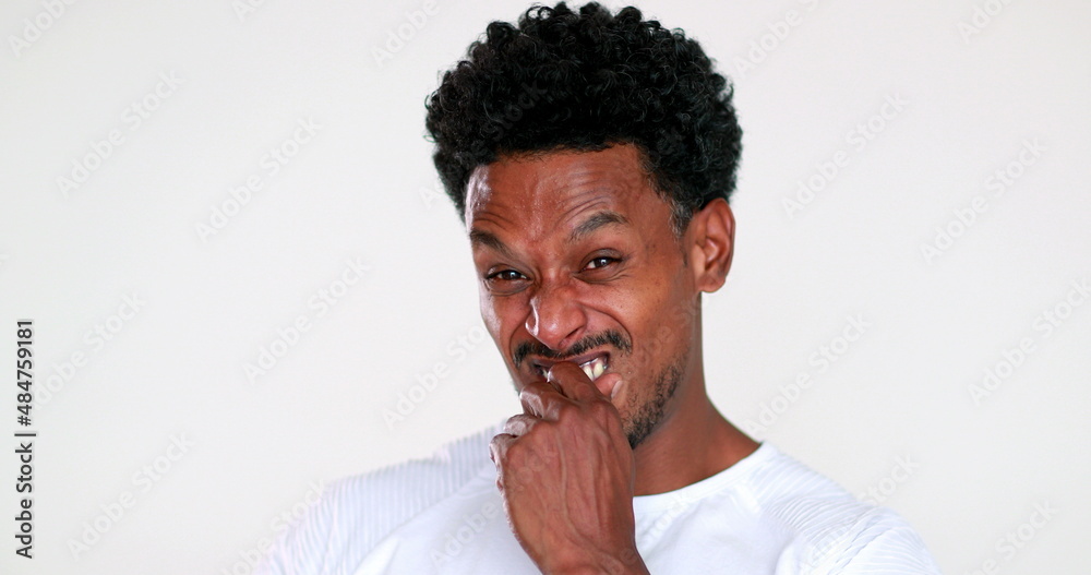 African man disgust face reaction. Black guy feeling dislike African man disgust face reaction. Black guy feeling dislike