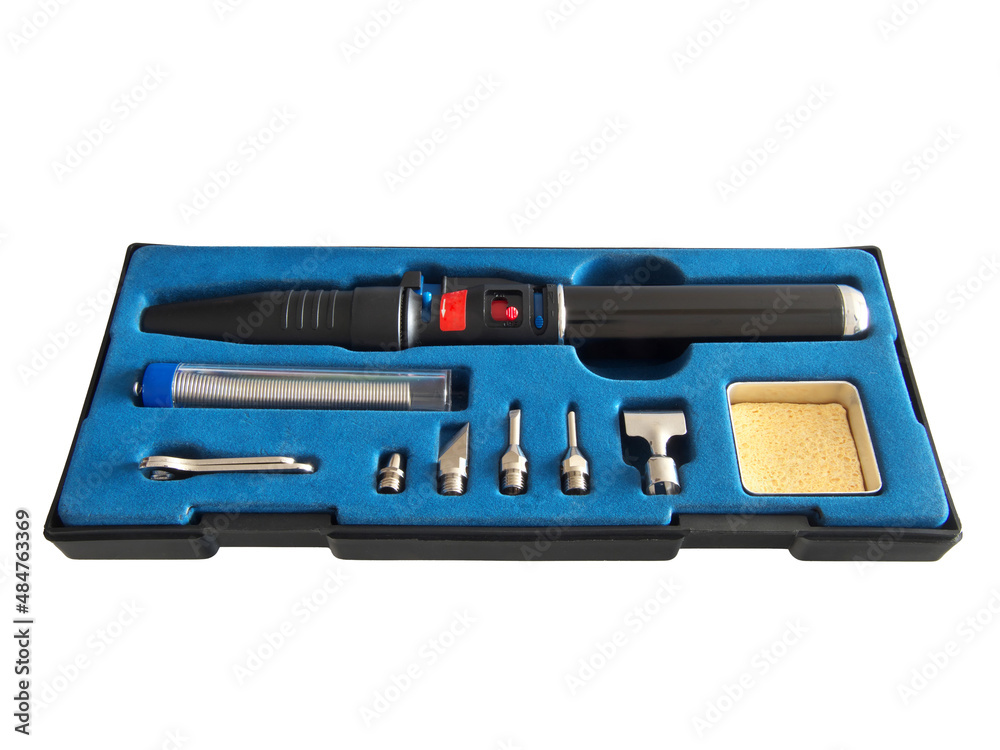 Autonomous gas soldering iron in a shipping box isolated on a white background. Autonomous gas soldering iron in a shipping box isolated on a white background.
