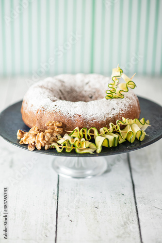 Obraz na płótnie A zucchini and walnut cake decorated with ingredients w salonie