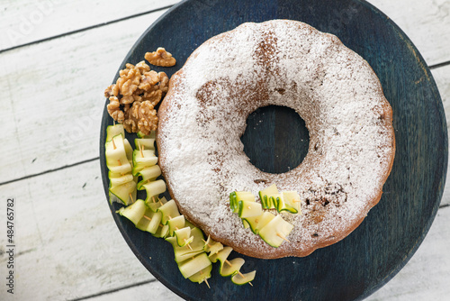 Obraz na płótnie A zucchini and walnut cake decorated with ingredients w salonie