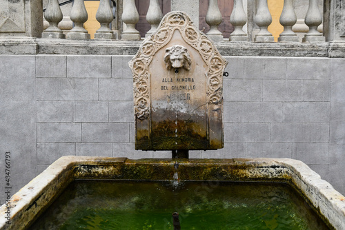 Detail of the ancient fountain with white marble bath, gift of the English colonel Momber, resident in Sanremo at the beginning of the 20th century, Imperia, Liguria, Italy