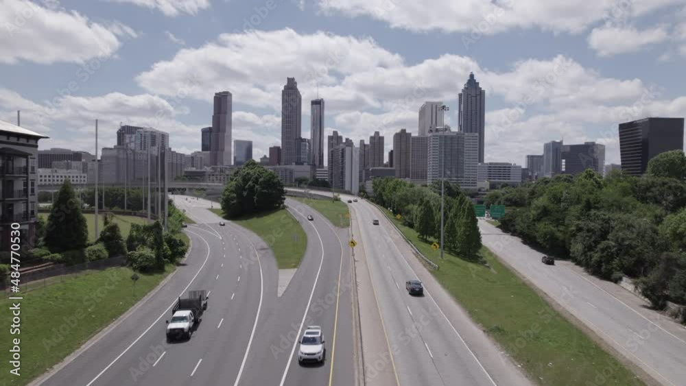 Aerial Drone Shot Day Push In from Highway through City Skyline Aerial Drone Shot Day Push In from Highway through City Skyline