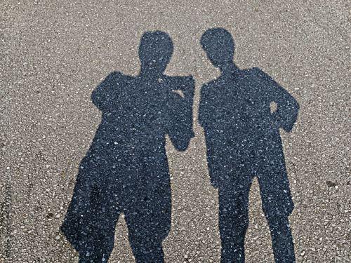 shadow people on road surface