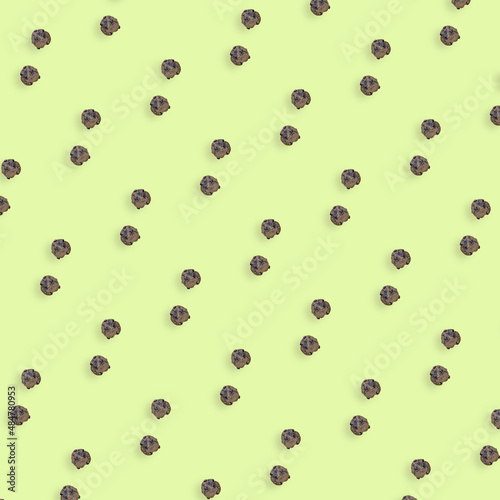 Colorful pattern of fresh chocolate chip cookies on yellow background. Top view. Flat lay. Pop art design