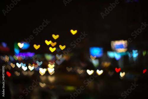 bokeh and blur abstract heart shape love valentine colorful night light at on street