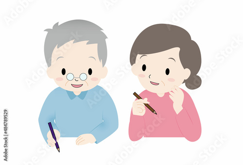高齢者のおじいさん、おばあさん２人が机上で何か書いている、塗り絵、絵を描いている、終活