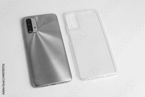 New cellphone with transparent cover over isolated white background