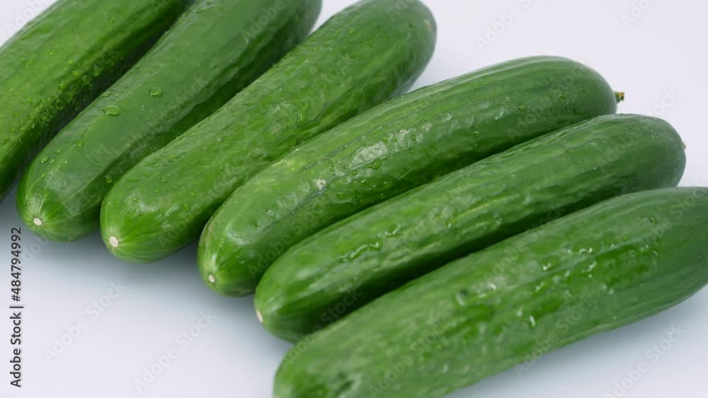 Fresh Green Cucumbers Rotate. Healthy and Vegetarian Food. Macro Fresh Green Cucumbers Rotate. Healthy and Vegetarian Food. Macro