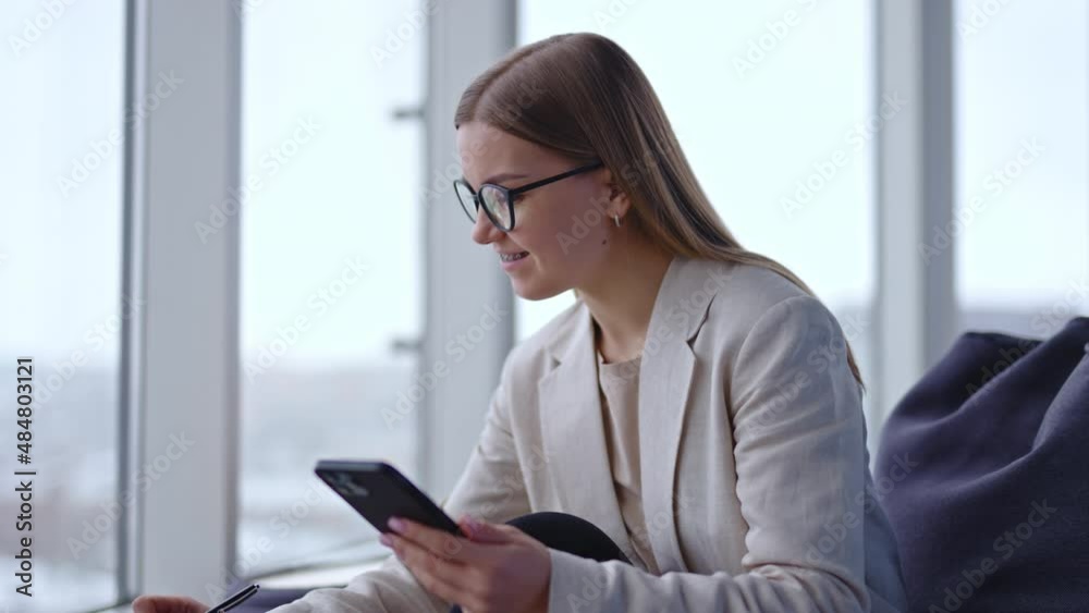 Beautiful young business wonan working with phone. Office business lady smartphone working. Beautiful young business wonan working with phone. Office business lady smartphone working.