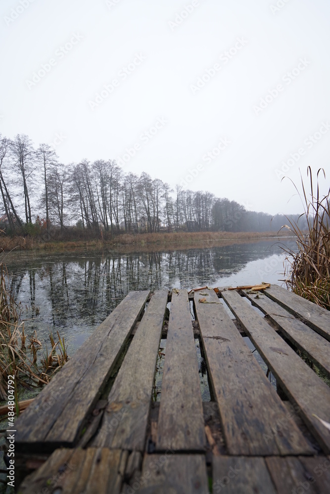 Naklejka premium wooden bridge over lake