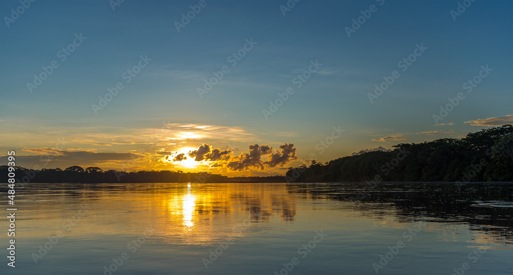 Amazon rainforest sunset panorama along the Pastaza river, Ecuador.