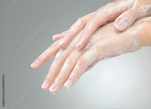 hands with soap foam ad bubbles