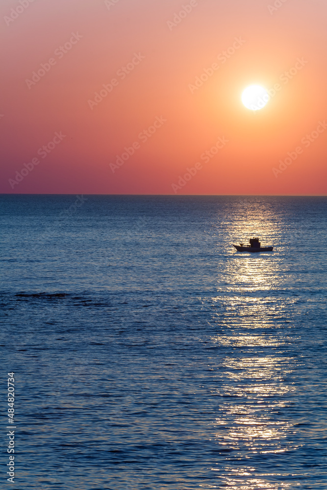 Sunset over fishing boat