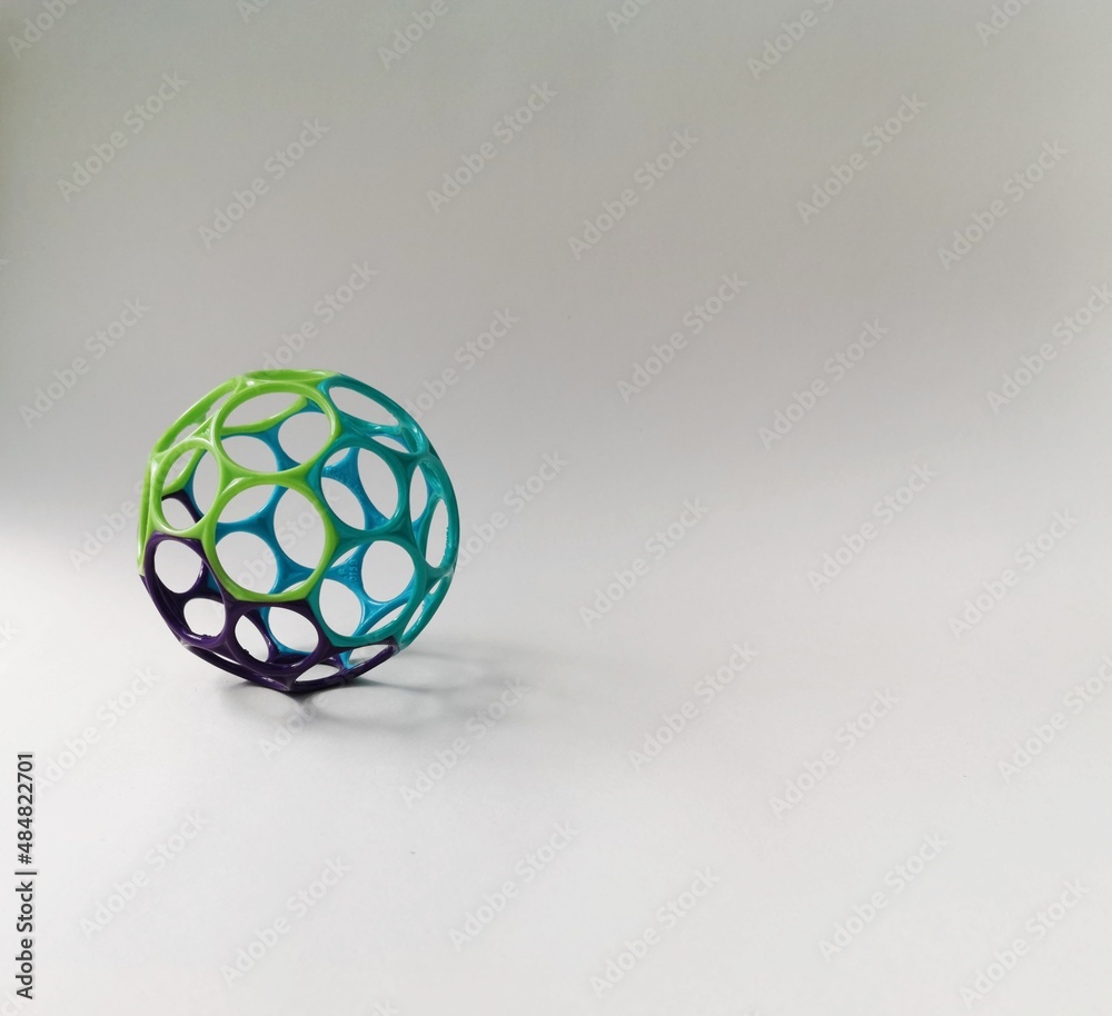 A plastic ball with hexagonal holes. A plastic ball with hexagonal holes.