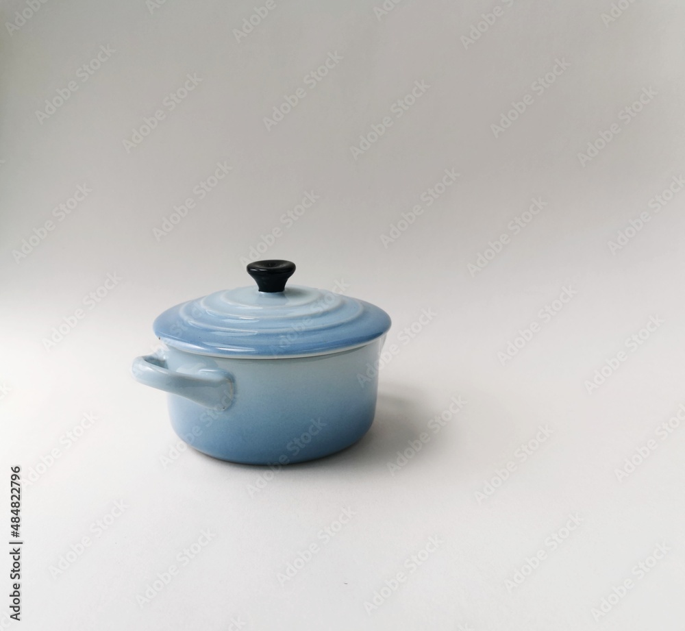 A tiny blue pot. Decorative display. A tiny blue pot. Decorative display.