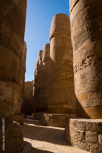 Egyptian antique columns on a blue sky.