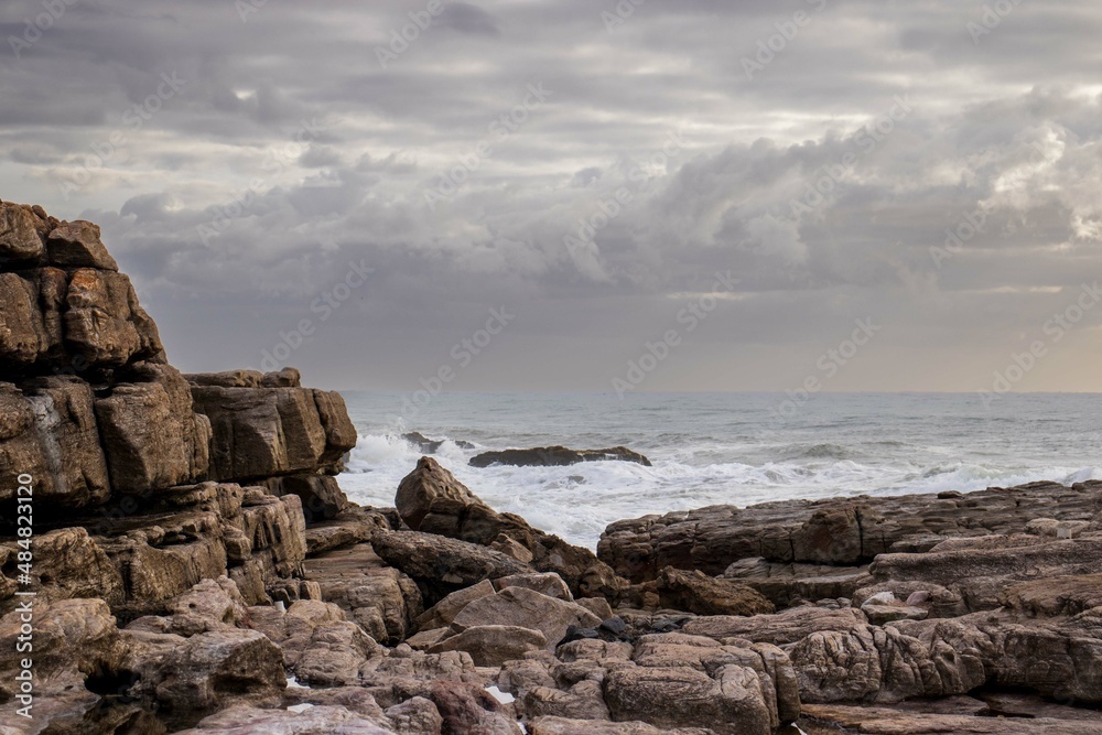 Seascape view with rocks and waves of Uvongu in Margate, the South Coast of South Africa