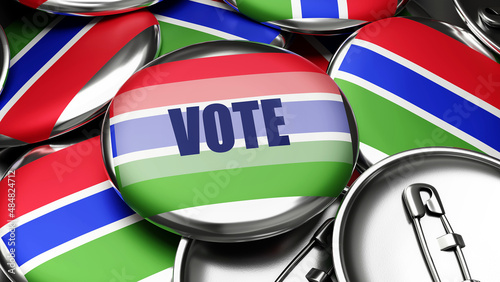 Vote in Gambia - national flag of Gambia on dozens of pinback buttons symbolizing upcoming Vote in this country. , 3d illustration
