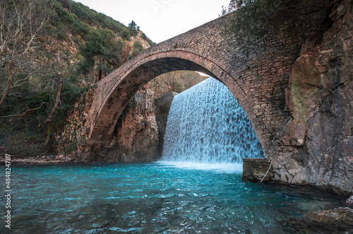 Historical stone bridge of Palaiokarya with its two artificial waterfalls situated close to Trikala and Meteora. photo