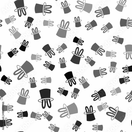 Black Magician hat and rabbit ears icon isolated seamless pattern on white background. Magic trick. Mystery entertainment concept. Vector
