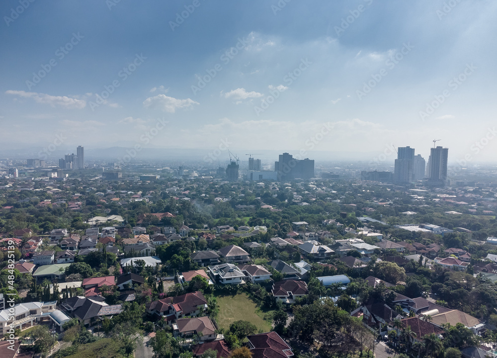 Aerial shot of the Manila skyline skyscraper clusters as seen from Corinthian Gardens.  
