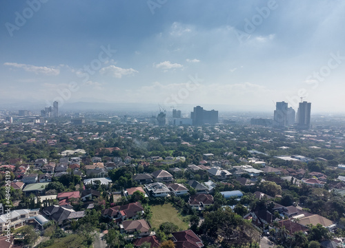 Aerial shot of the Manila skyline skyscraper clusters as seen from Corinthian Gardens. 