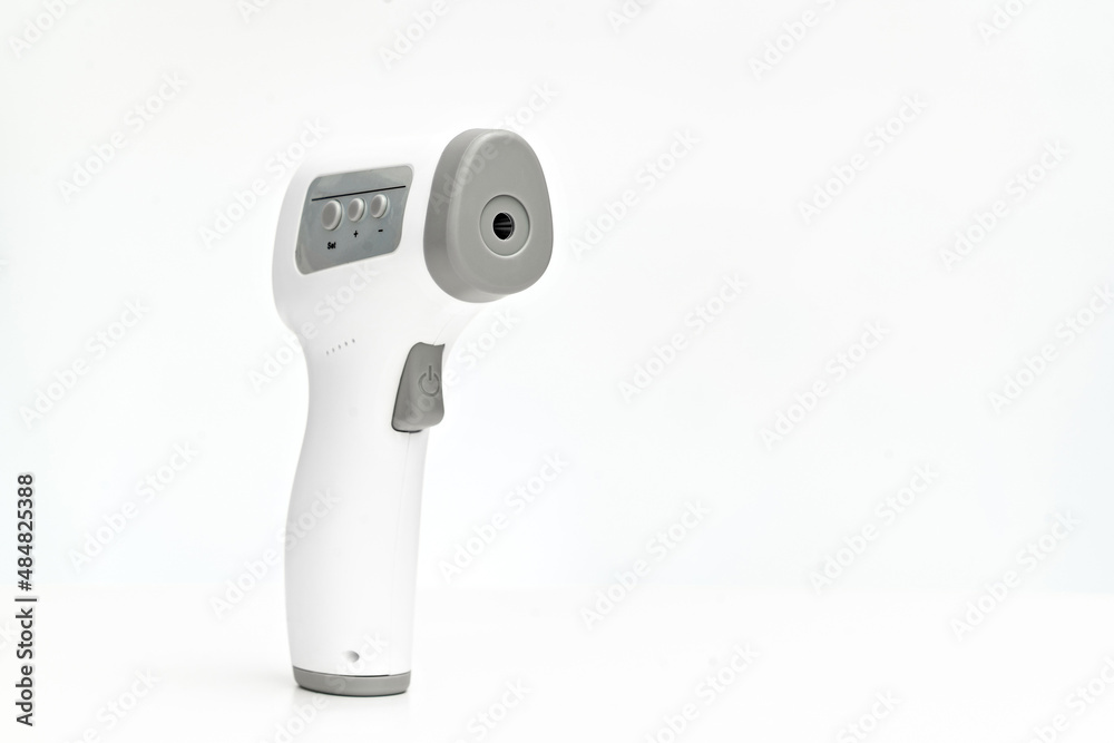 measuring device for measuring body temperature. contactless electronic thermometer on a white background. home medicine cabinet. sale of medical products for home use. measuring device for measuring body temperature. contactless electronic thermometer on a white background. home medicine cabinet. sale of medical products for home use.