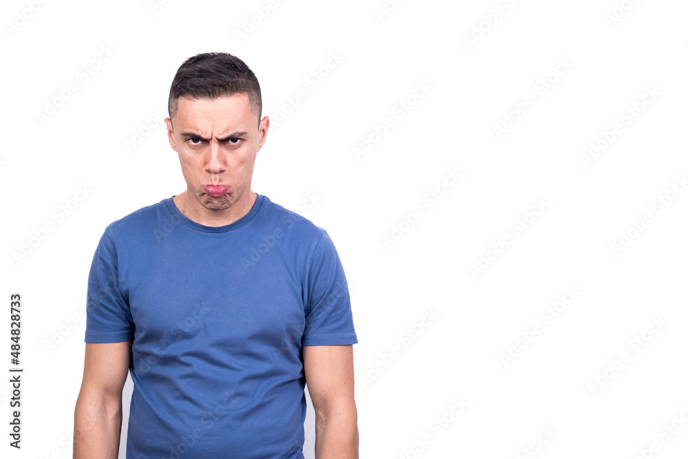 Portrait of an adult man standing and grimacing angrily Portrait of an adult man standing and grimacing angrily