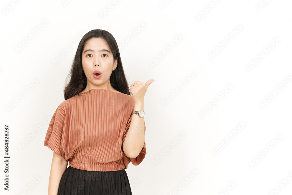 Showing and Pointing Product With Thumb Of Beautiful Asian Woman Isolated On White Background Showing and Pointing Product With Thumb Of Beautiful Asian Woman Isolated On White Background