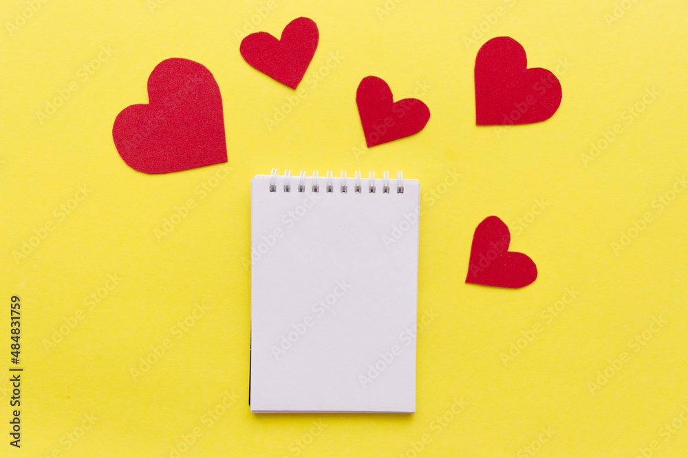 empty notebook with red heart on yellow background with space for your text empty notebook with red heart on yellow background with space for your text