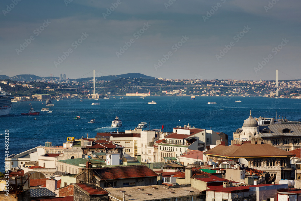 Beautiful view of the city and the sea, sea strait, bridge, ships. Travel to Bosphorus, Istanbul, Turkey.