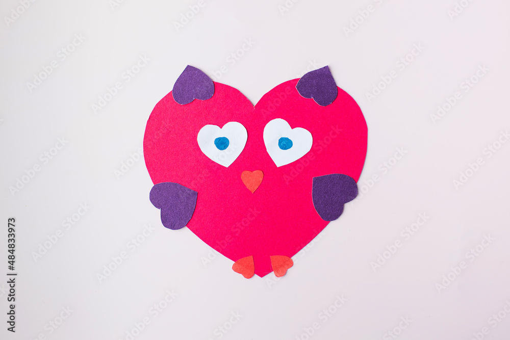 Fototapeta premium The owl-shaped valentine is made of paper. Children's crafts.