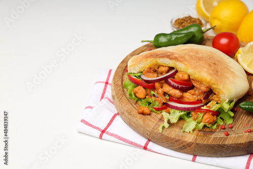 Concept of tasty food with pita with chicken, space for text