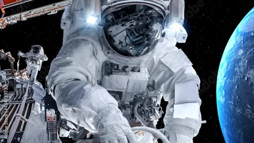 Astronaut spaceman do spacewalk while working for spaceflight mission at space station . Astronaut wear full spacesuit for operation . Elements of this image furnished by NASA space astronaut photos .
