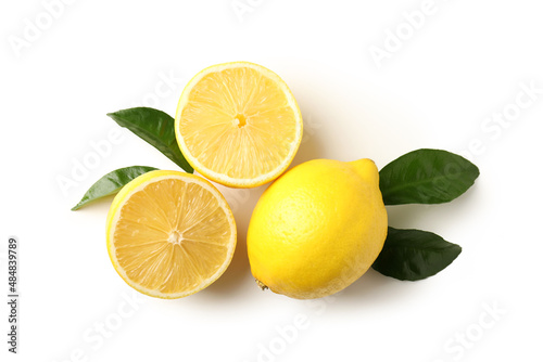 Lemons and leaves on white background, top view