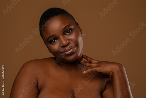 Beautiful curvy African Cmerican woman posing at camera