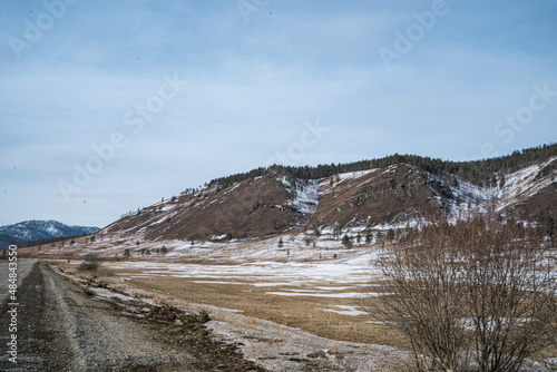 road to baikal, ice of baikal, blue ice of baikal with methane bubbles, transparent ice of baikal, boat on ice