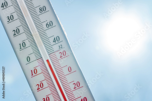Thermometer in the snow. Climate, weather, forecast. Temperatures outside. Thermometer in the snow shows temperatures below zero. Low temperatures in degrees Celsius and fahrenheit in snowy weather