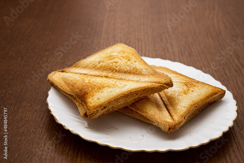 two toasted slices of bread on a white plate