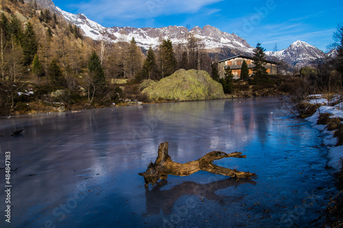 A scenic view of a piece of wood on a frozen lake in the Pass of Montets, Haute Savoie, France photo