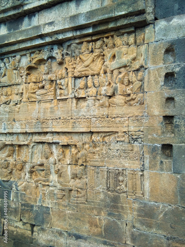 Ancient carved wall at Borobudur Temple. Borobudur Temple is an ancient Buddhist temple which is located in Magelang  Central Java  Indonesia.