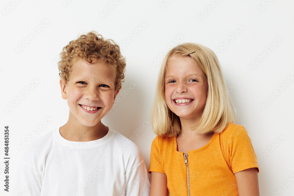Portrait of cute children casual clothes posing emotions studio isolated background unaltered Portrait of cute children casual clothes posing emotions studio isolated background unaltered