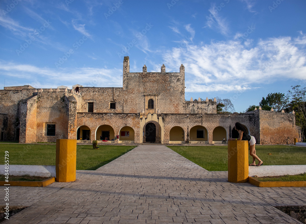 Fototapeta premium Tourist enjoying a vacation at the convent of San Bernardino of Siena in Valladolid (Mexico), on the Yucatan Peninsula.