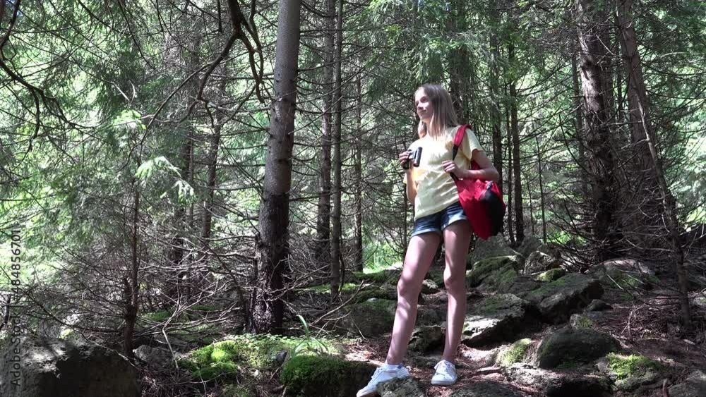Child Using Binoculars in Mountains Forest, Kid Hiking at Camping, Wood Alpine Trails, Girl Traveling in Adventure Trip Vacation Child Using Binoculars in Mountains Forest, Kid Hiking at Camping, Wood Alpine Trails, Girl Traveling in Adventure Trip Vacation