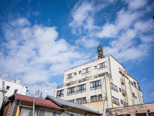 exterior of old hot spring hotel and winter blue sky with cloud in chikuma city