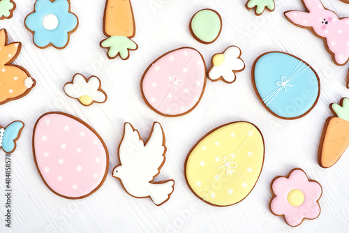 Easter greeting card with gingerbread cookies. Easter spring decorative composition with homemade easter cookies in shape of funny rabbit and eggs