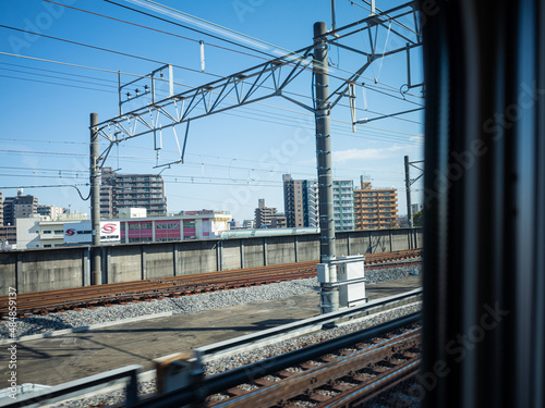 cityscape and railway from the window of bullet train in japan