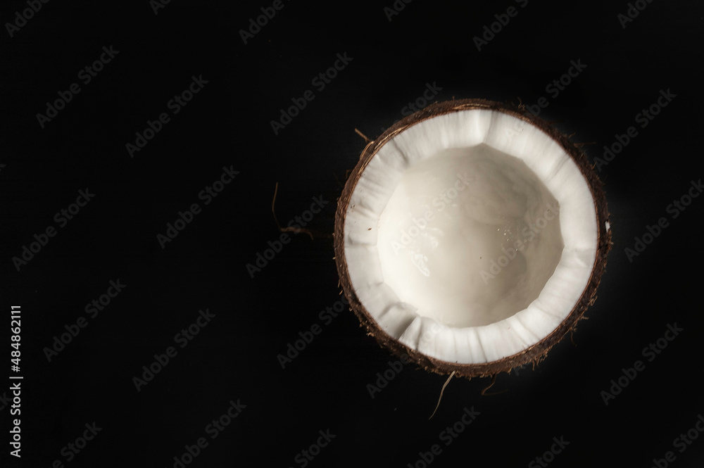Fototapeta premium Fresh raw coconut isolated on white background. High resolution image